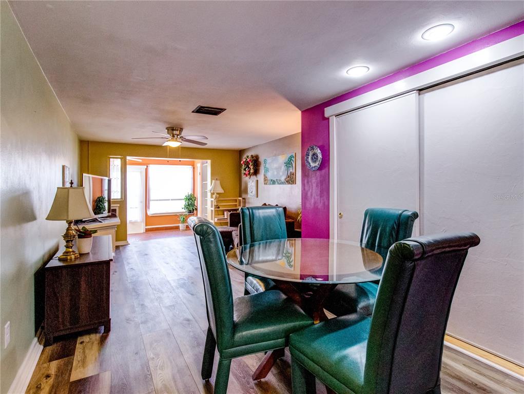 Undisclosed Address New Port Richey, FL 34652 - Photo 14 of 48 a view of a dining room with furniture window and wooden floor