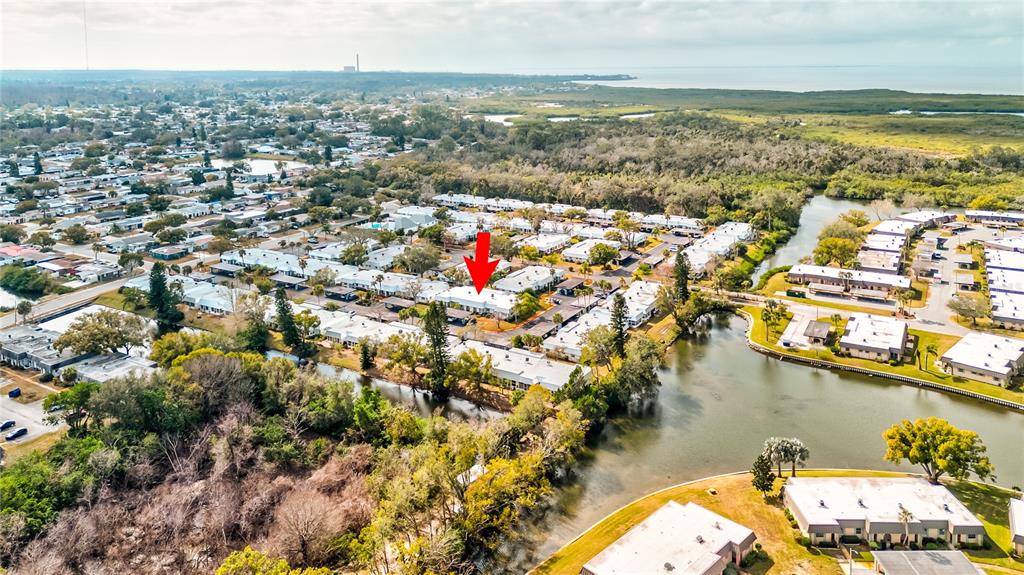Undisclosed Address New Port Richey, FL 34652 - Photo 2 of 48 an aerial view of residential houses with outdoor space