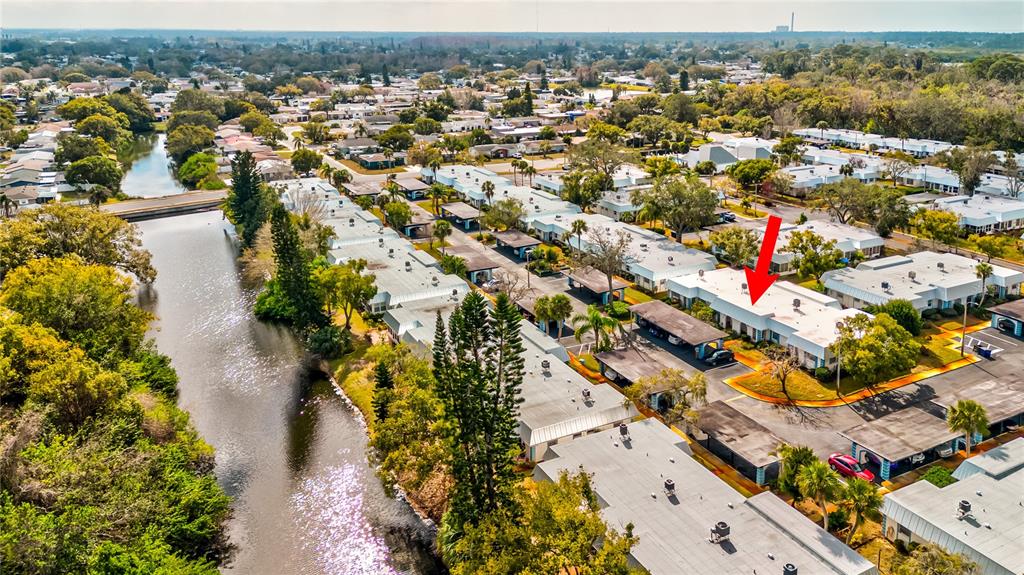 Undisclosed Address New Port Richey, FL 34652 - Photo 3 of 48 an aerial view of residential houses with outdoor space and swimming pool