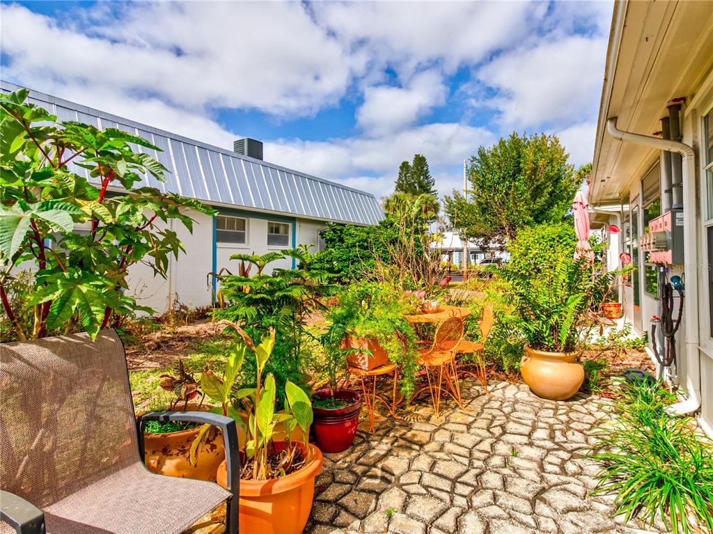 Undisclosed Address New Port Richey, FL 34652 - Photo 34 of 48 a view of a chairs and table in a patio