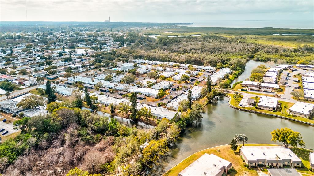 Undisclosed Address New Port Richey, FL 34652 - Photo 39 of 48 an aerial view of residential houses with outdoor space