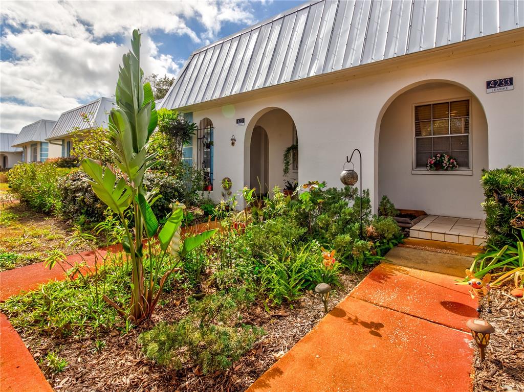 Undisclosed Address New Port Richey, FL 34652 - Photo 5 of 48 a front view of a house with a yard