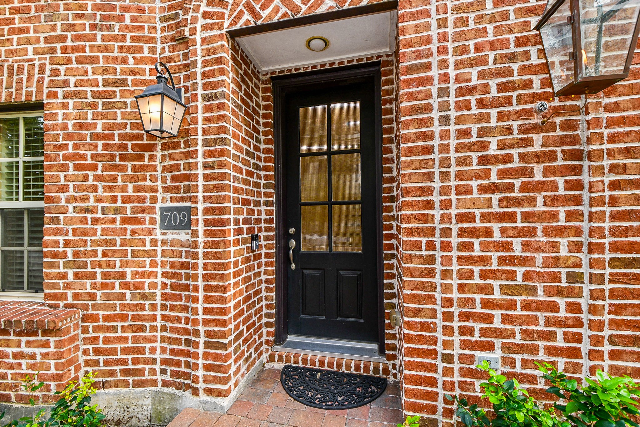 709 Delano Street Houston, TX 77003 - Photo 2 of 36 a view of a door with a brick wall
