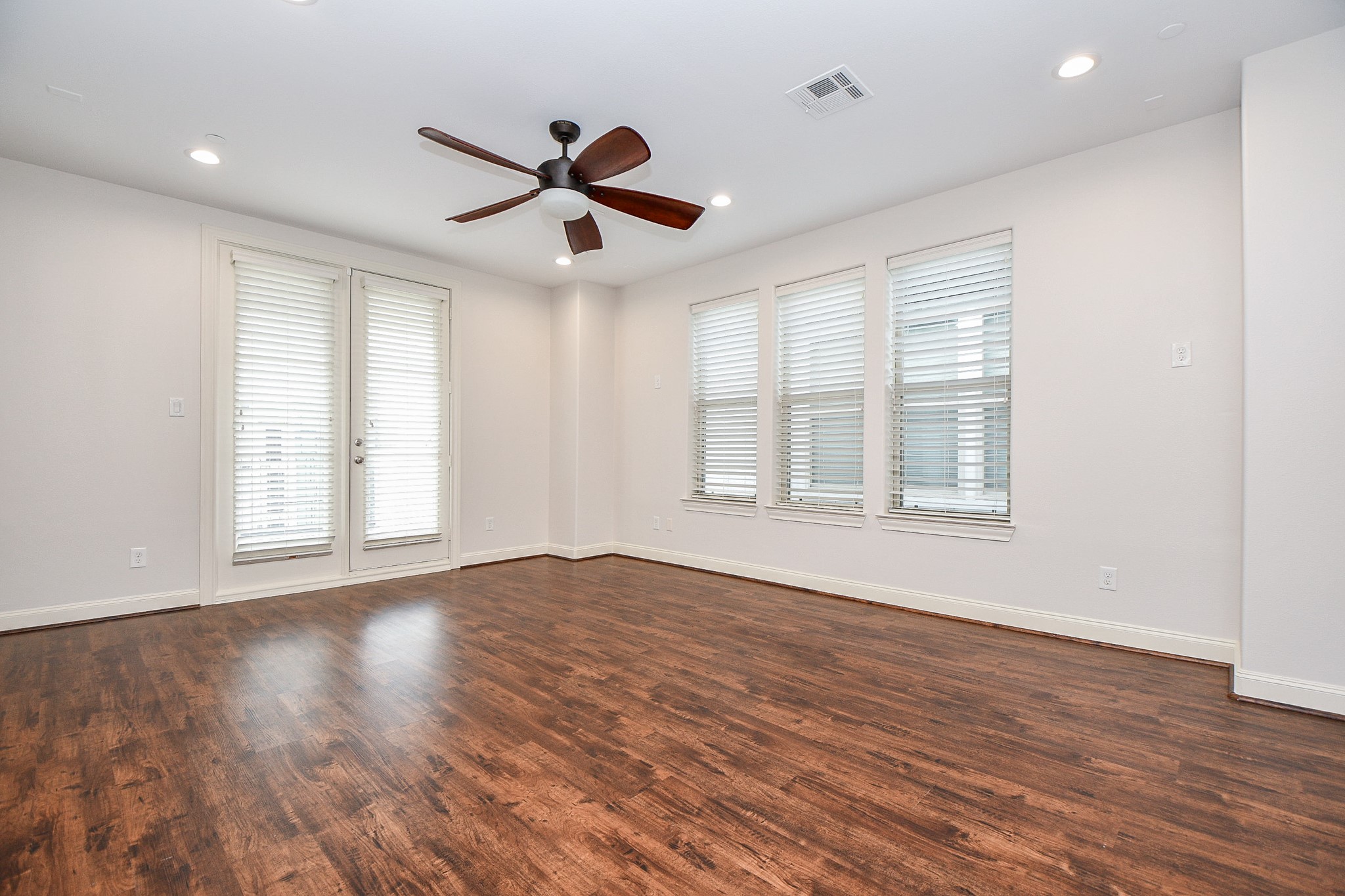709 Delano Street Houston, TX 77003 - Photo 24 of 36 a view of an empty room with wooden floor and a window