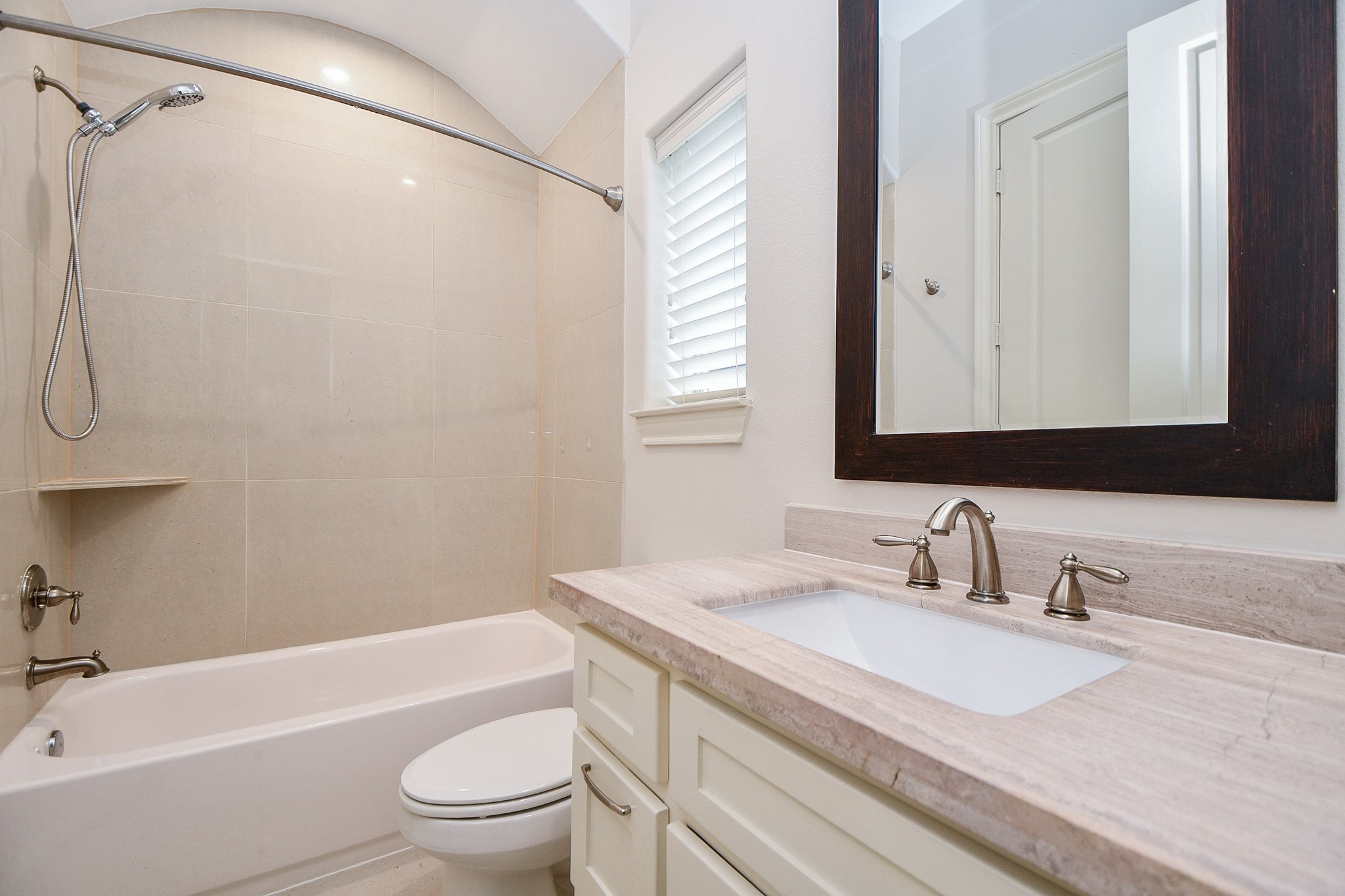 709 Delano Street Houston, TX 77003 - Photo 29 of 36 a bathroom with a granite countertop sink toilet and shower