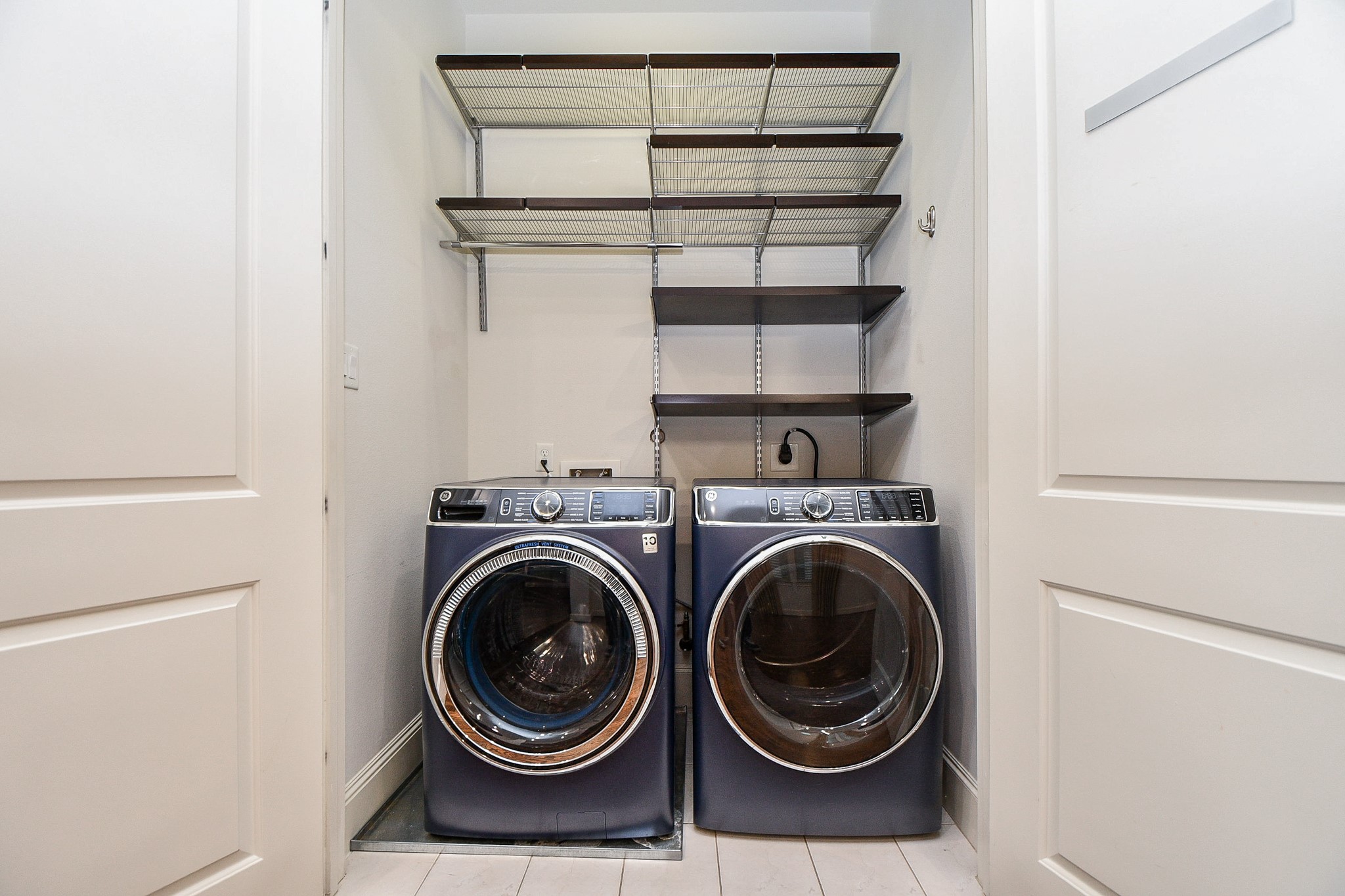 709 Delano Street Houston, TX 77003 - Photo 31 of 36 a view of storage and utility room with washer and dryer