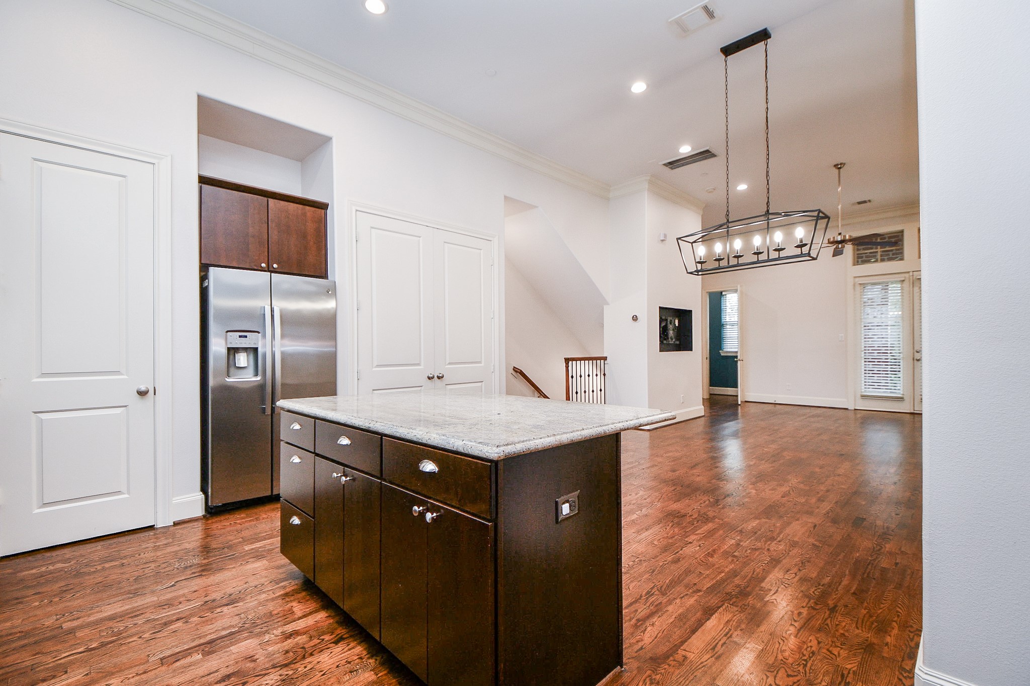 709 Delano Street Houston, TX 77003 - Photo 9 of 36 a kitchen with stainless steel appliances granite countertop a sink a refrigerator and a stove