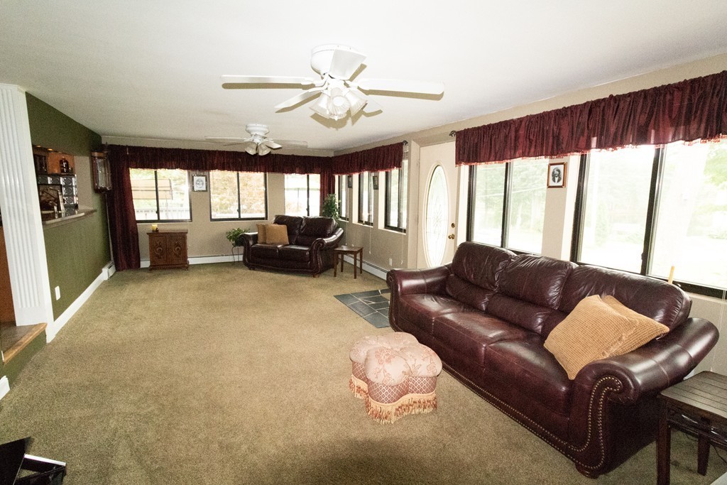 44 Flint Road Tyngsborough, MA 01879 - Photo 10 of 29 a living room with furniture and a large window