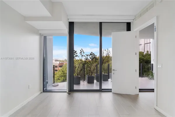 a balcony with lots of green space