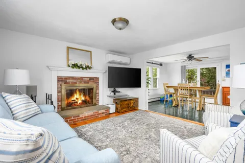 a bathroom with a sink a toilet and a shower curtain