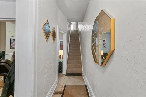 a view of a entryway door with hallway