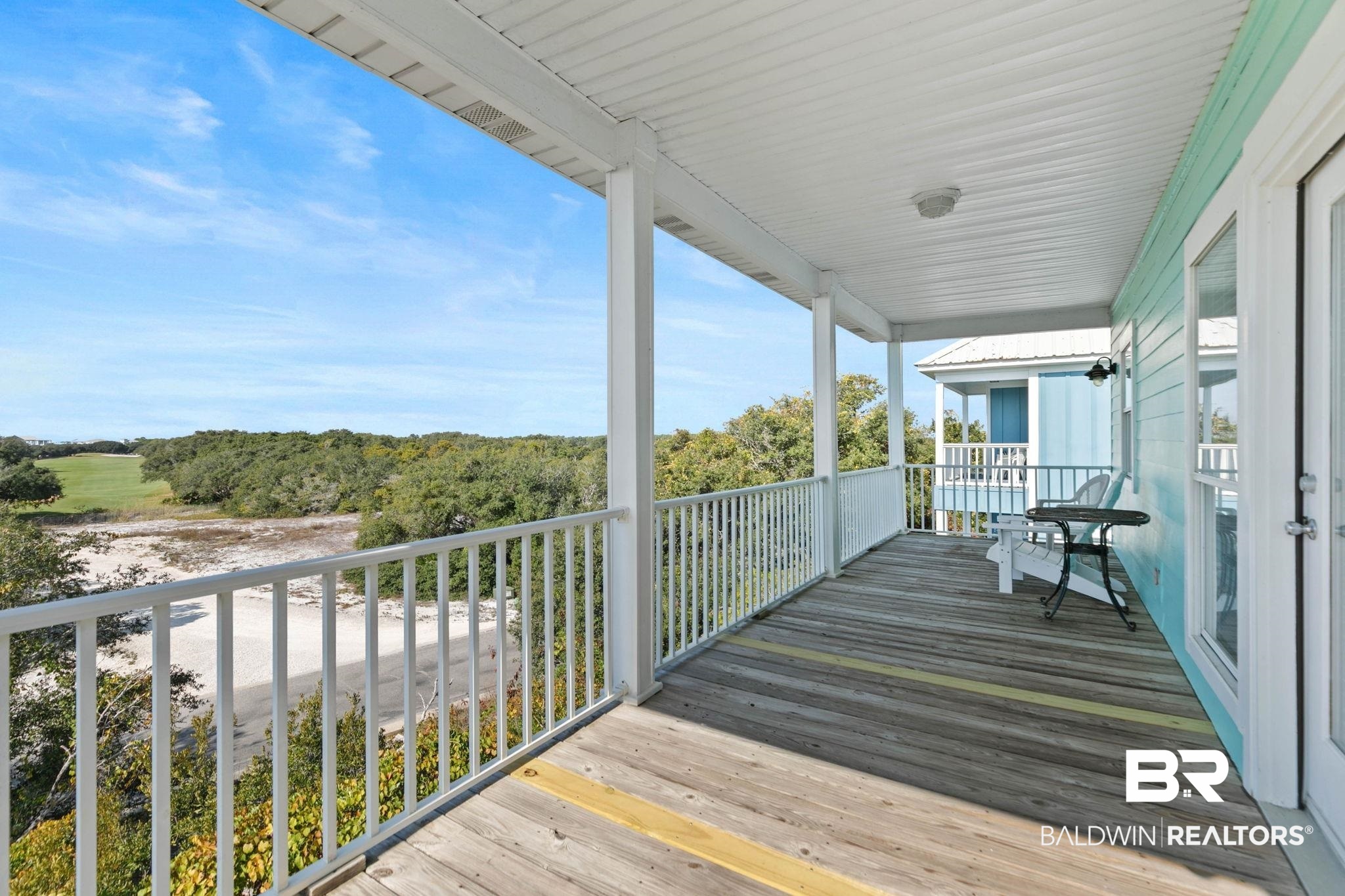 545 Plantation Road, Unit 3 Gulf Shores, AL 36542 - Photo 45 of 54 Deck featuring view of wooded area