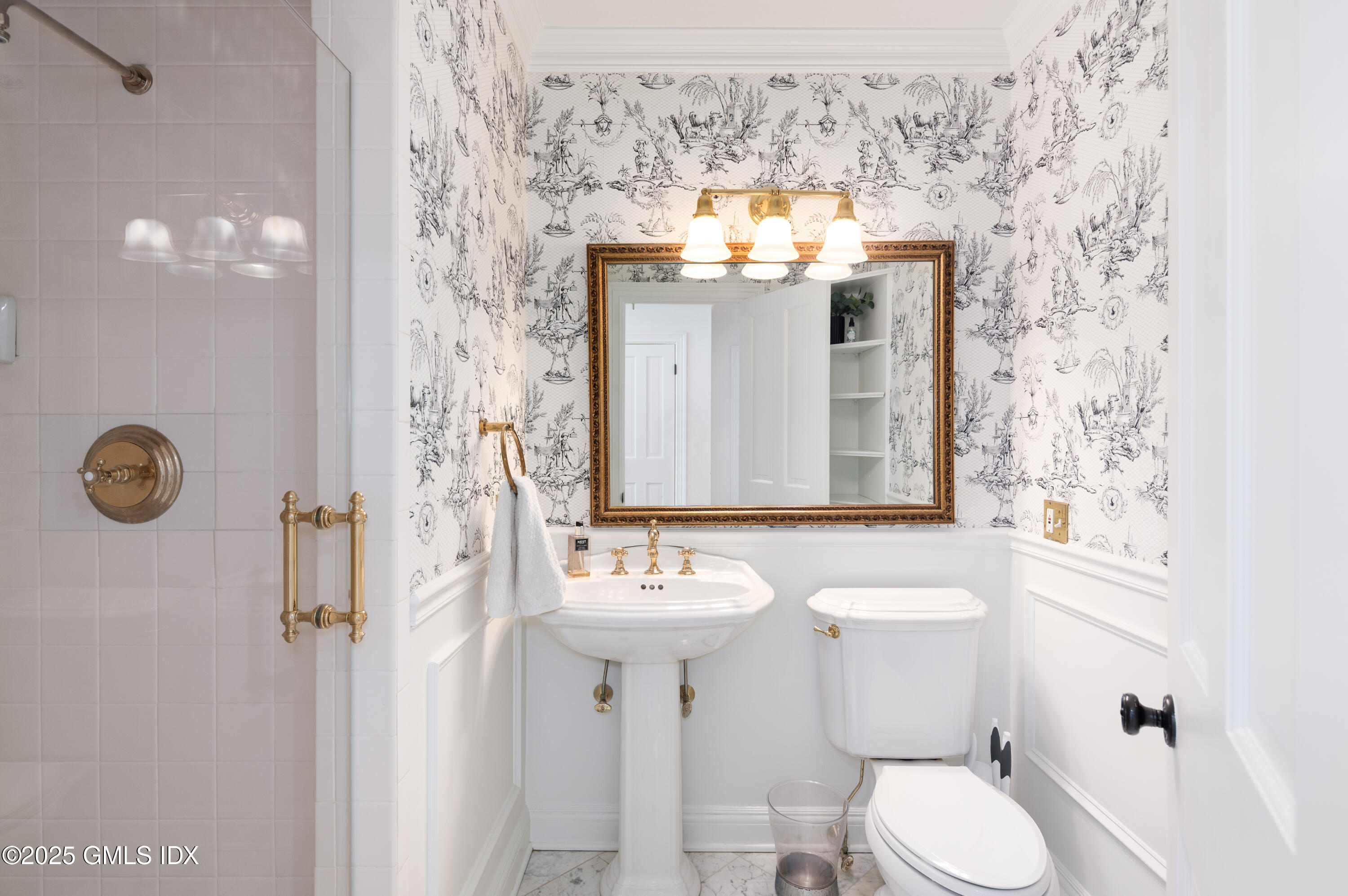 40 Ridgeview Avenue Greenwich, CT 06830 - Photo 13 of 38 a bathroom with a sink vanity mirror and toilet