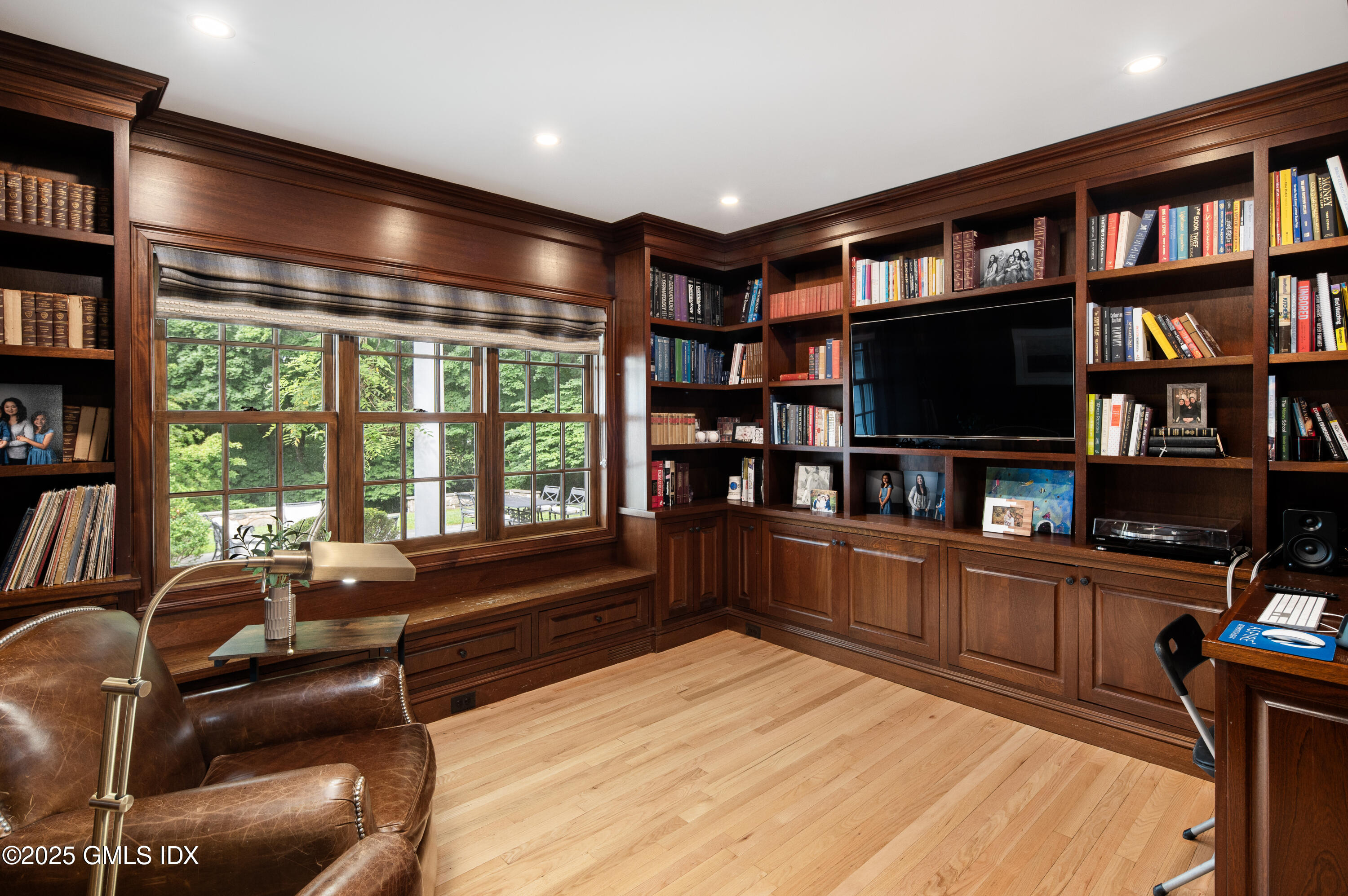 40 Ridgeview Avenue Greenwich, CT 06830 - Photo 14 of 38 a room with furniture lots of furniture and a book shelf