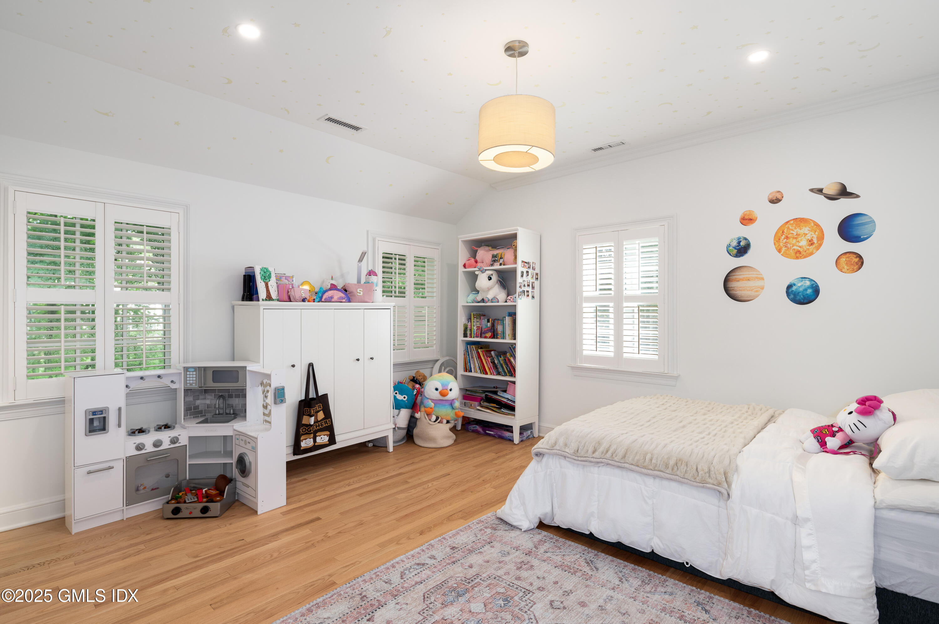 40 Ridgeview Avenue Greenwich, CT 06830 - Photo 21 of 38 a bedroom with a bed and a wooden floor