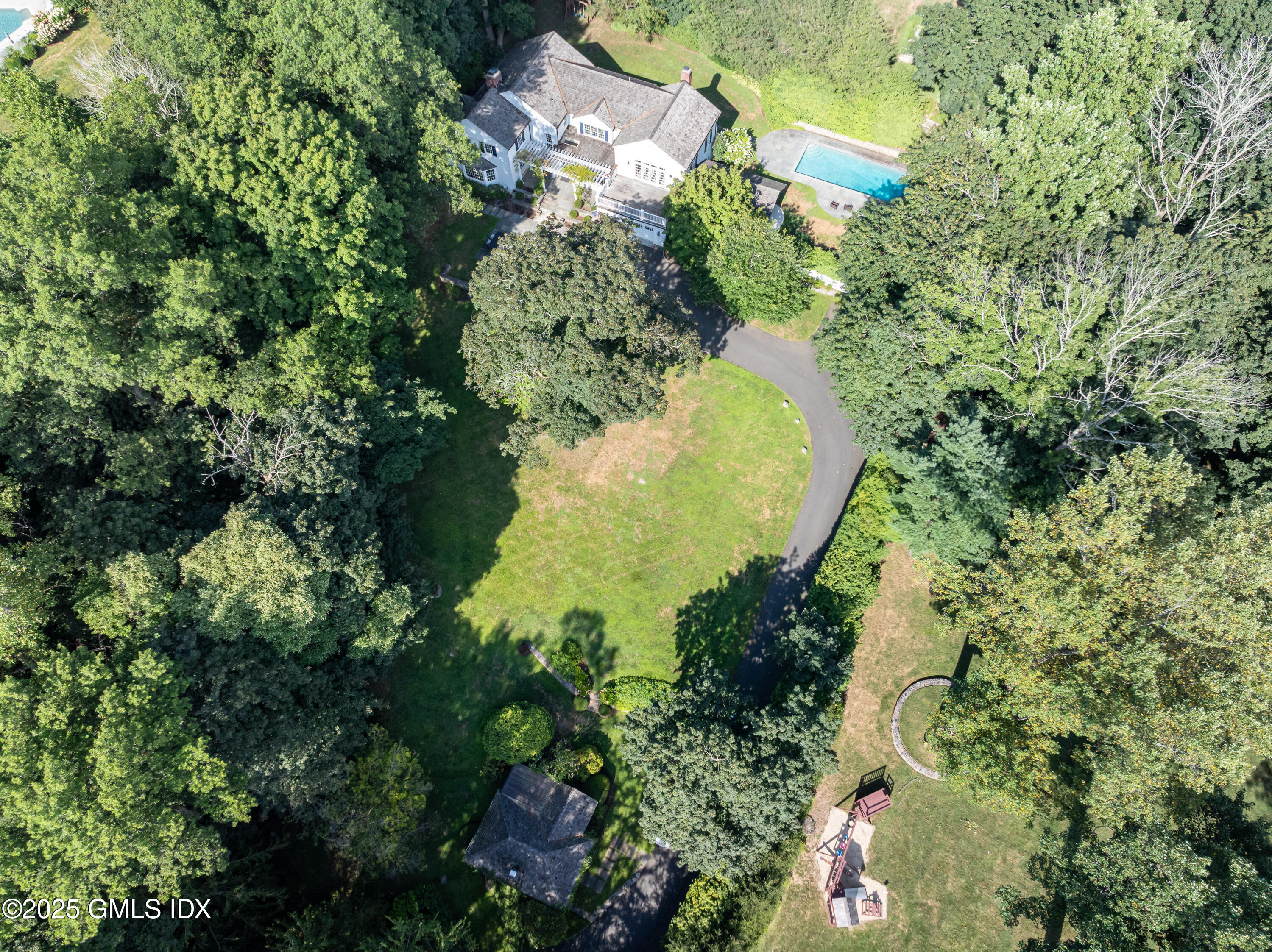 40 Ridgeview Avenue Greenwich, CT 06830 - Photo 38 of 38 an aerial view of a house with a yard and large trees
