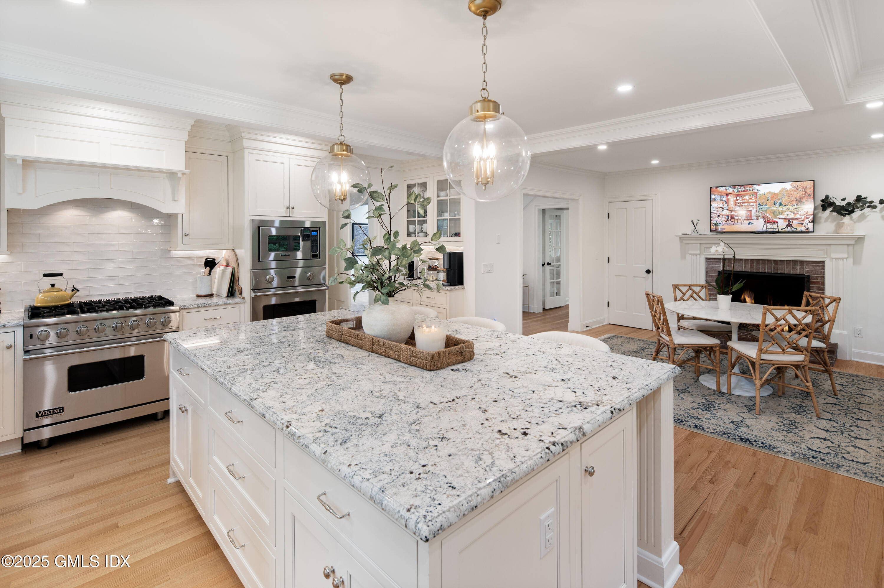 40 Ridgeview Avenue Greenwich, CT 06830 - Photo 6 of 38 a kitchen with a stove and a view of living room