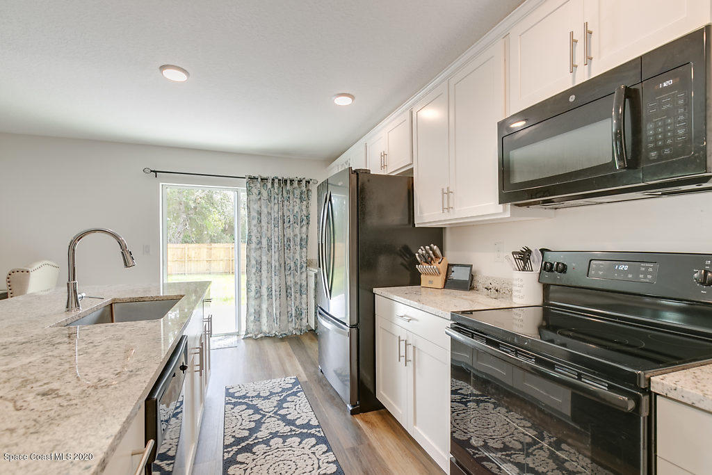 1443 Saxony Road Southwest Palm Bay, FL 32908 - Photo 6 of 21 Kitchen 1