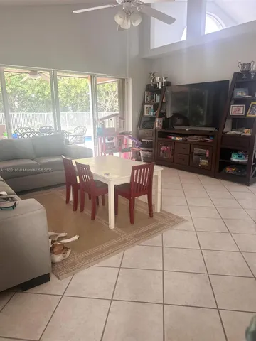 a view of a dining room with furniture window and outside view