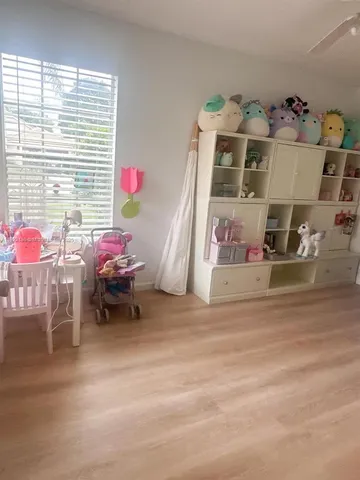 a bed room with a bed and a window