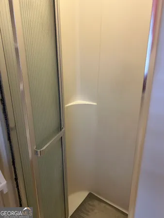 a bathroom with a glass door