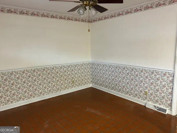 a view of a ceiling fan and a shower