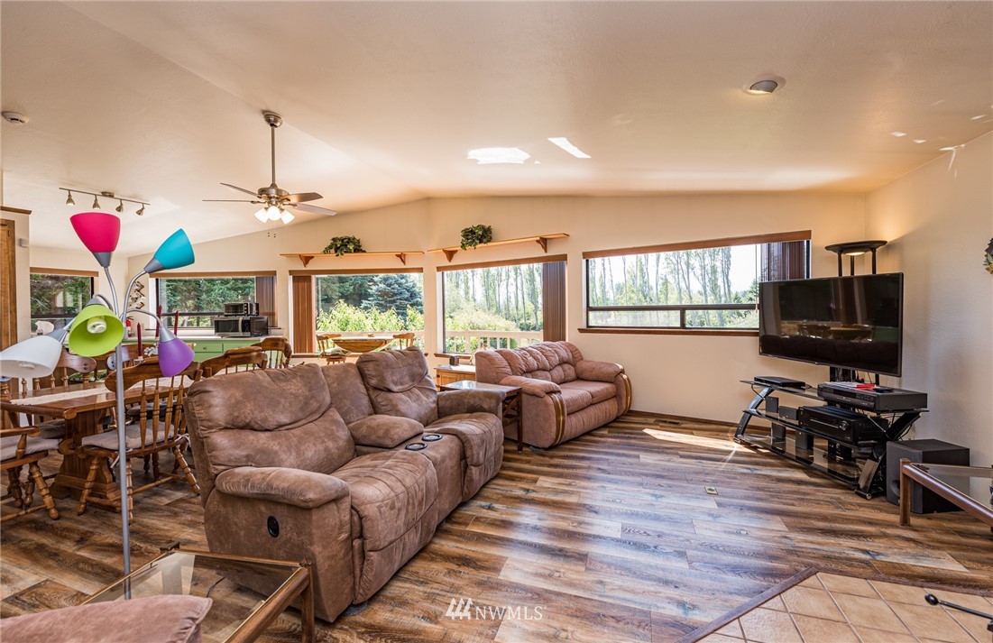 2522 Kitchen-Dick Road Sequim, WA 98382 - Photo 14 of 39 a living room with fireplace furniture and a flat screen tv