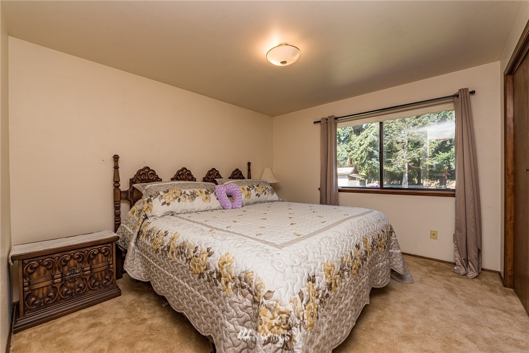 2522 Kitchen-Dick Road Sequim, WA 98382 - Photo 22 of 39 a bedroom with a bed and window