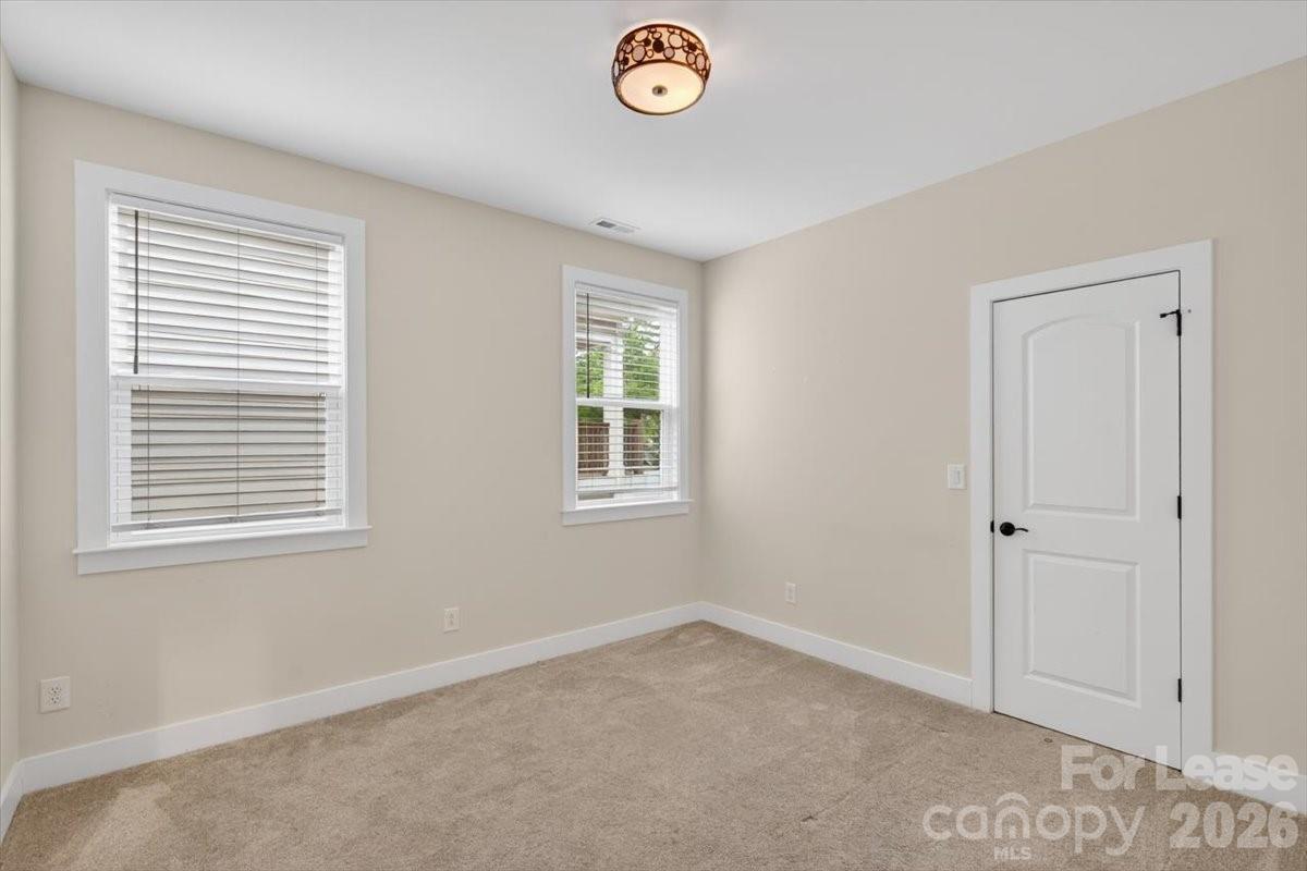 5201 Valley Stream Road Charlotte, NC 28209 - Photo 2 of 47 an empty room with a window