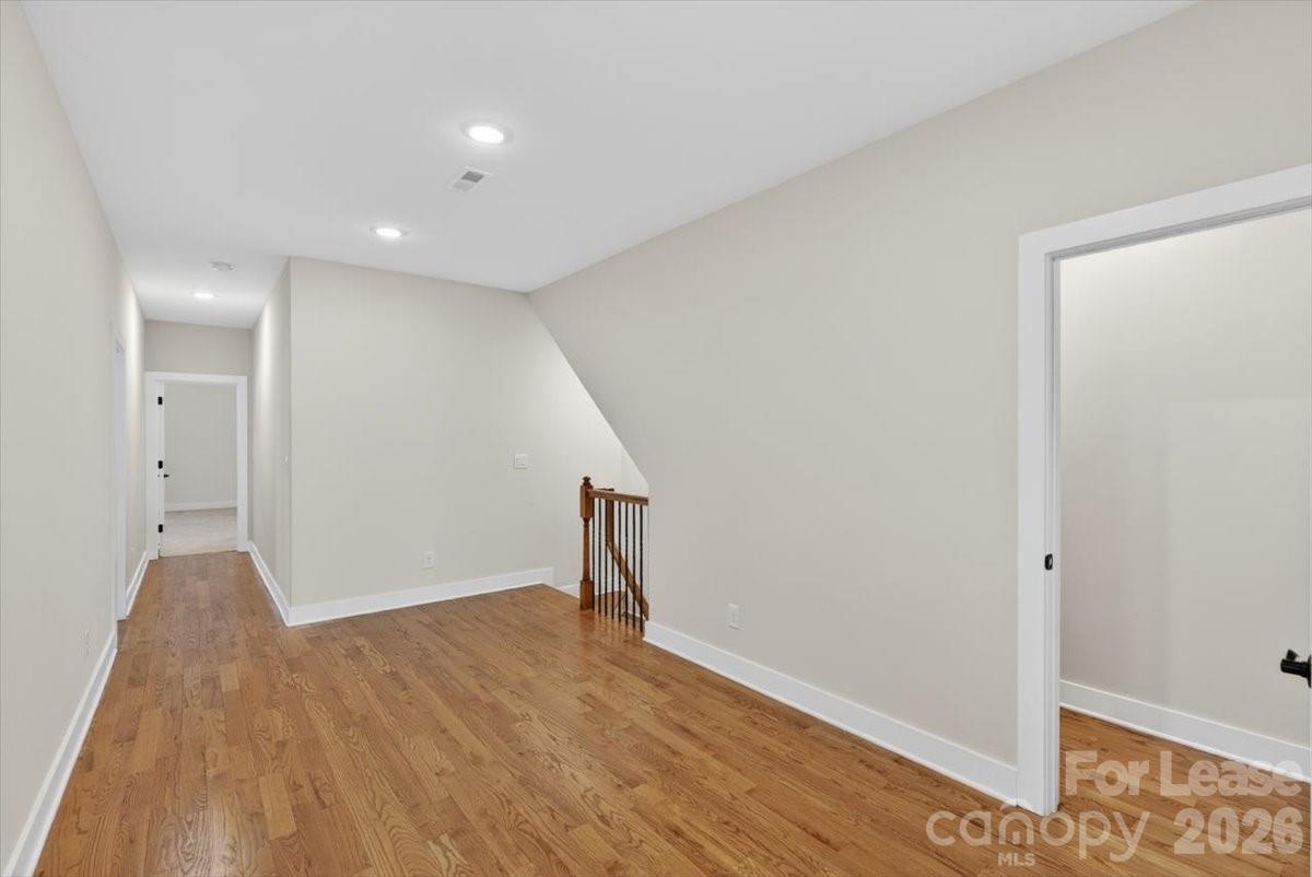 5201 Valley Stream Road Charlotte, NC 28209 - Photo 24 of 47 a view of empty room with wooden floor