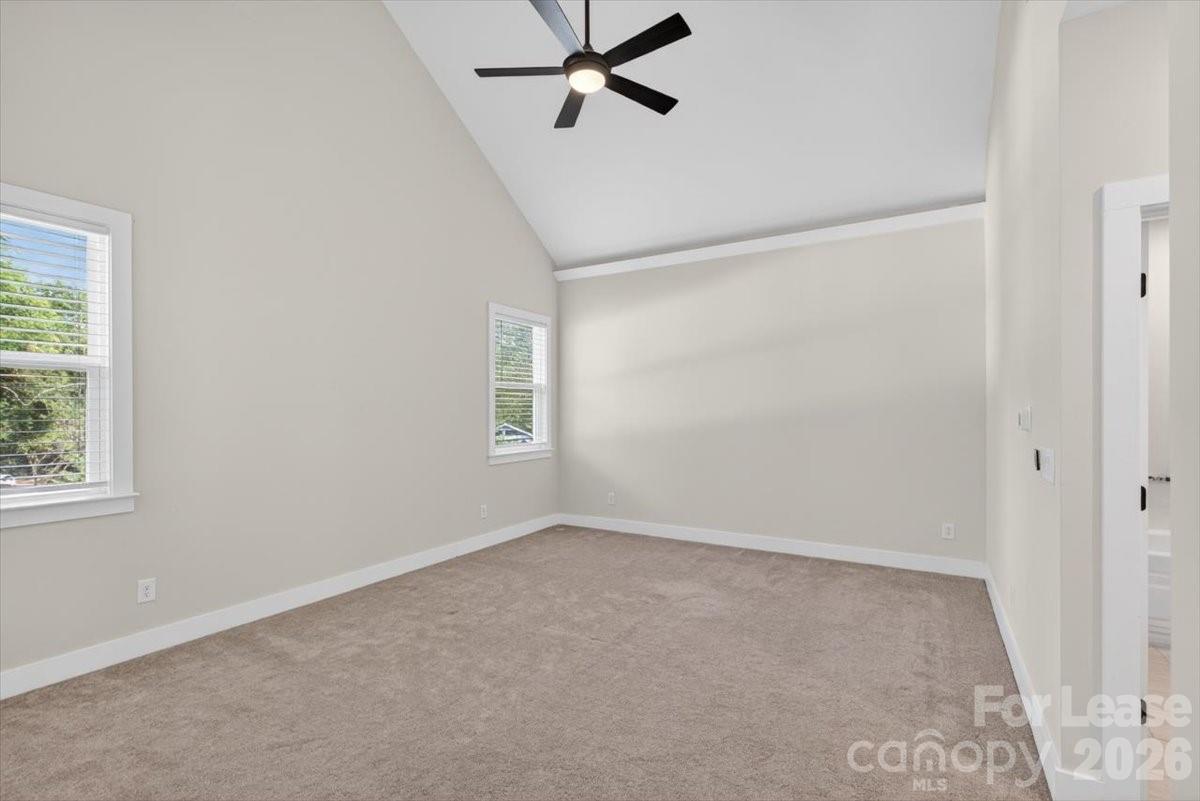 5201 Valley Stream Road Charlotte, NC 28209 - Photo 27 of 47 an empty room with windows and closet