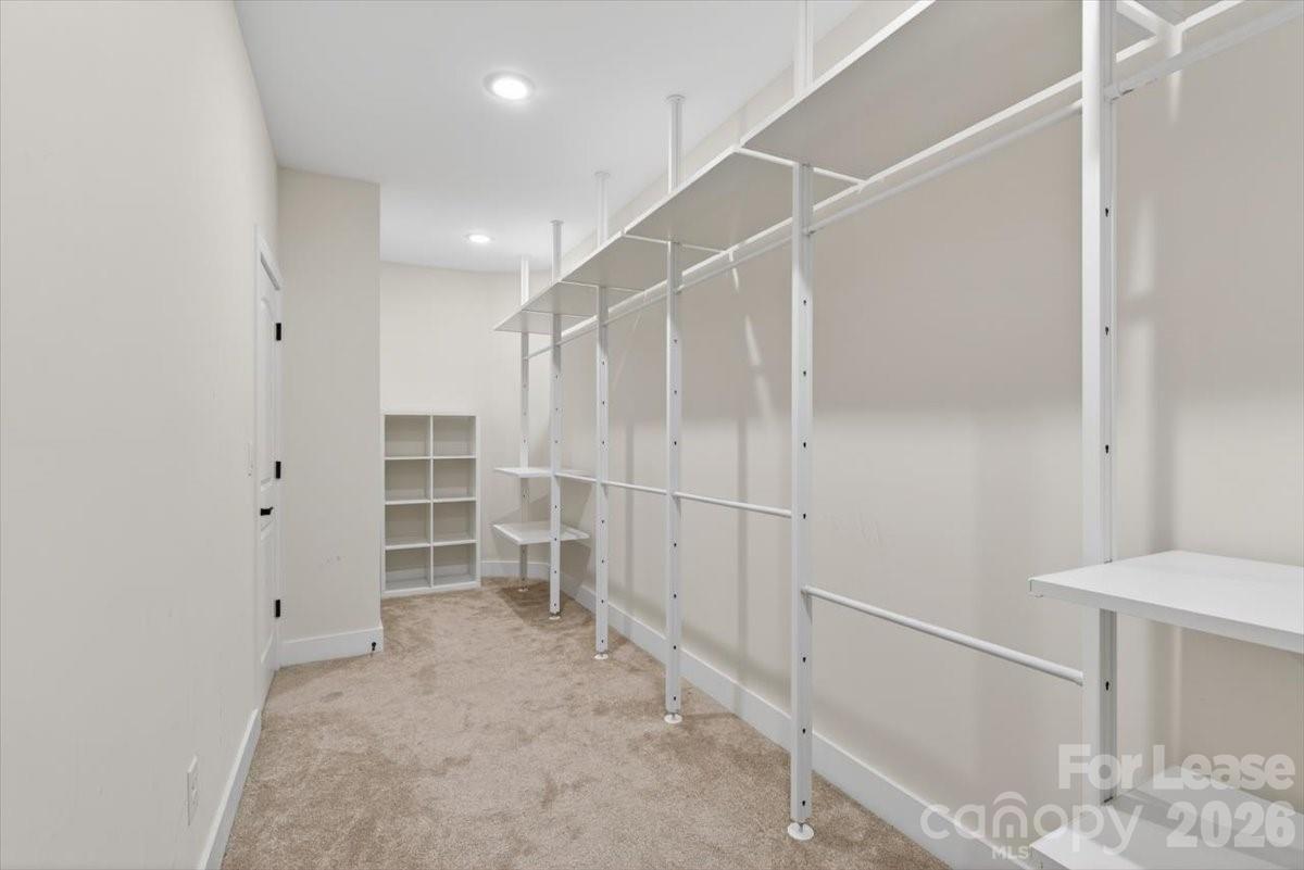 5201 Valley Stream Road Charlotte, NC 28209 - Photo 30 of 47 a view of walk in closet with empty racks