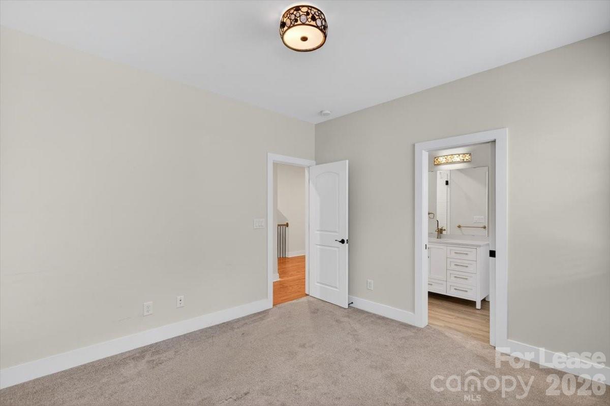 5201 Valley Stream Road Charlotte, NC 28209 - Photo 3 of 47 a view of an empty room and window