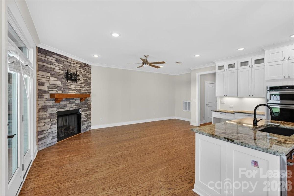 5201 Valley Stream Road Charlotte, NC 28209 - Photo 33 of 47 a kitchen with granite countertop a stove and a refrigerator