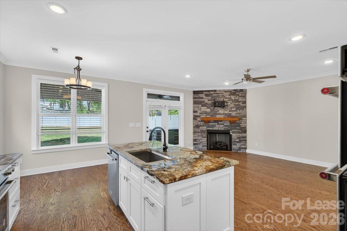 5201 Valley Stream Road Charlotte, NC 28209 - Photo 38 of 47 a kitchen with a stove and a refrigerator
