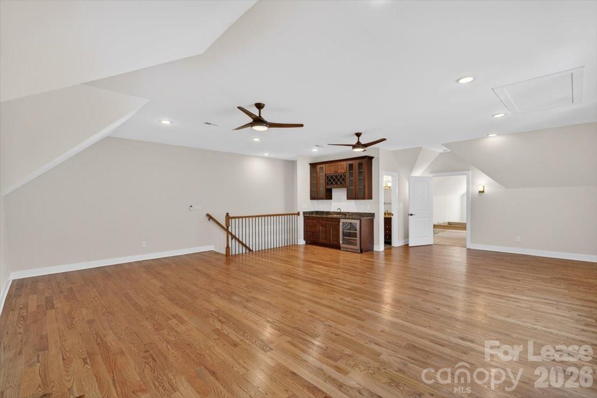 5201 Valley Stream Road Charlotte, NC 28209 - Photo 40 of 47 a view of a room with wooden floor and windows