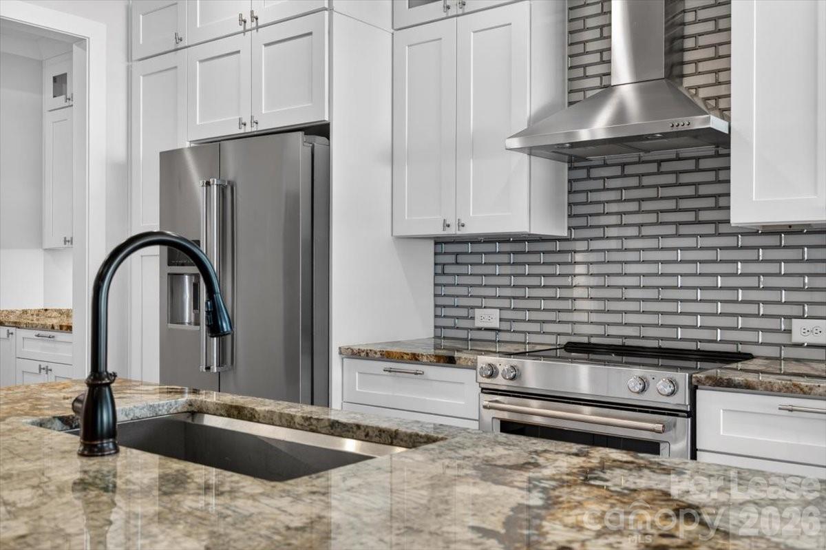 5201 Valley Stream Road Charlotte, NC 28209 - Photo 41 of 47 a view of a kitchen with granite countertop a sink and a stove
