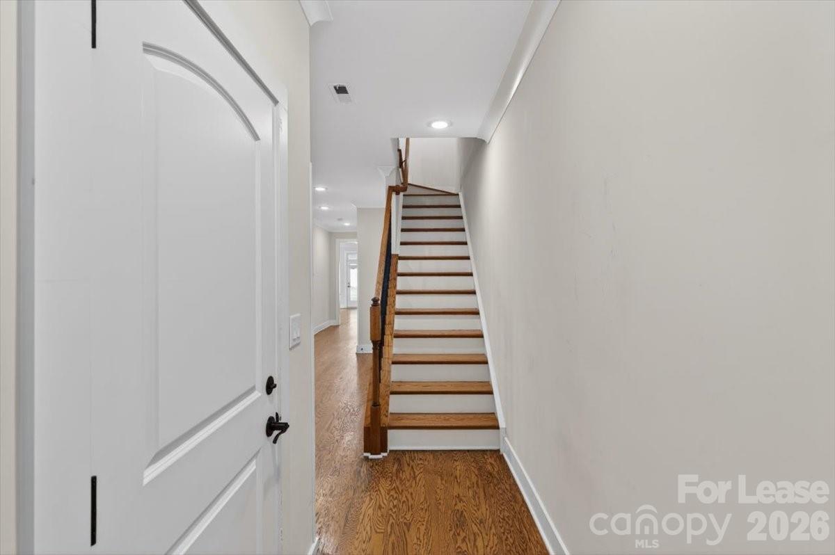 5201 Valley Stream Road Charlotte, NC 28209 - Photo 42 of 47 a view of a hallway with wooden floor and entryway