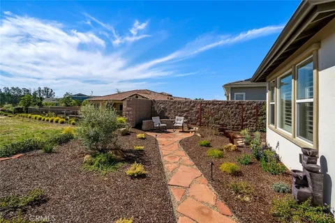 front view of a house with table and chairs