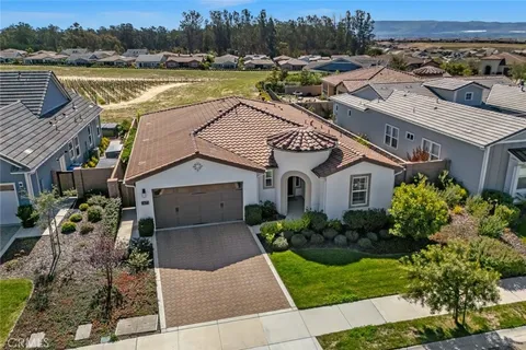 an aerial view of a house with a ocean view