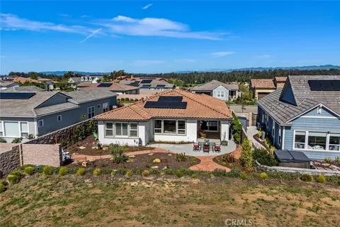 a outdoor living space with patio furniture and a fireplace