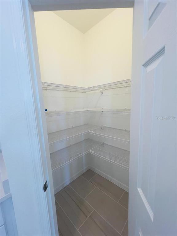 4638 Homestead Trail St. Cloud, FL 34772 - Photo 13 of 30 a view of walk in closet with empty racks