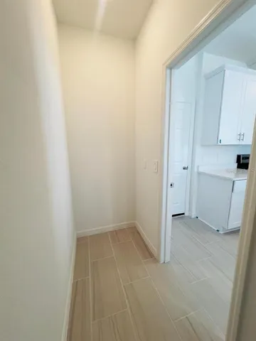 a bathroom with a sink toilet and a mirror