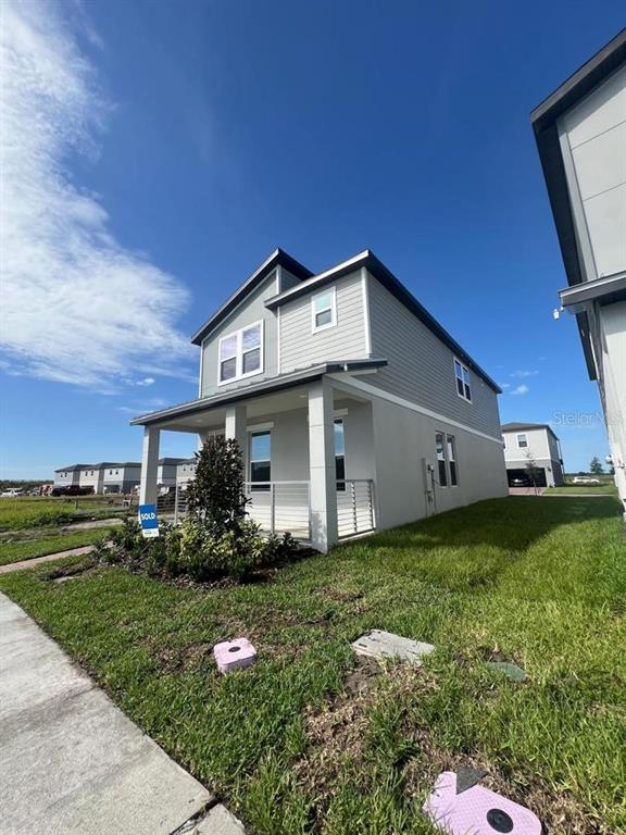 4638 Homestead Trail St. Cloud, FL 34772 - Photo 2 of 30 a front view of a house with garden