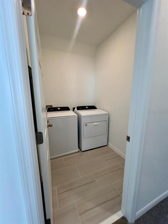 4638 Homestead Trail St. Cloud, FL 34772 - Photo 25 of 30 a utility room with dryer and washer