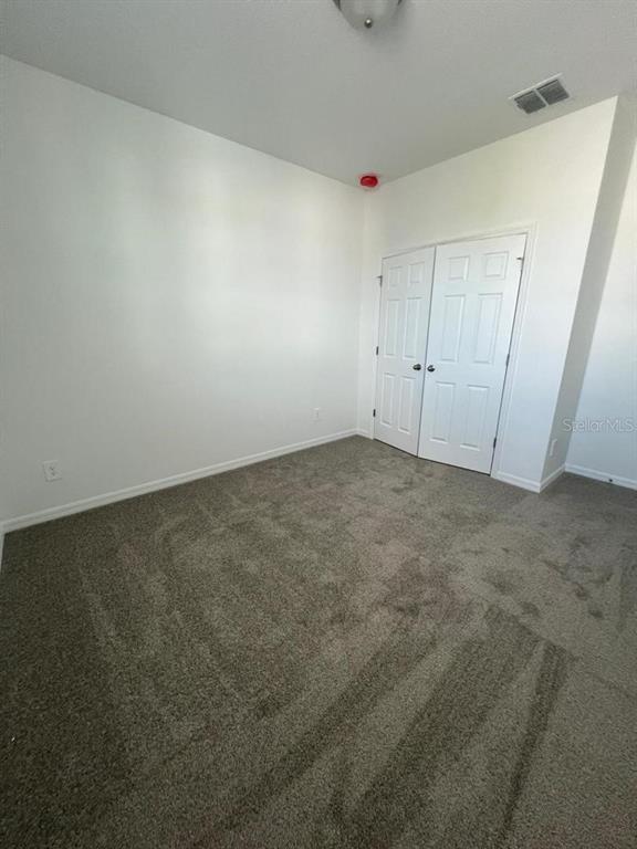 4638 Homestead Trail St. Cloud, FL 34772 - Photo 26 of 30 an empty room with a natural light