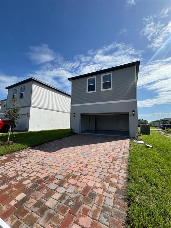 4638 Homestead Trail St. Cloud, FL 34772 - Photo 28 of 30 a front view of house with yard