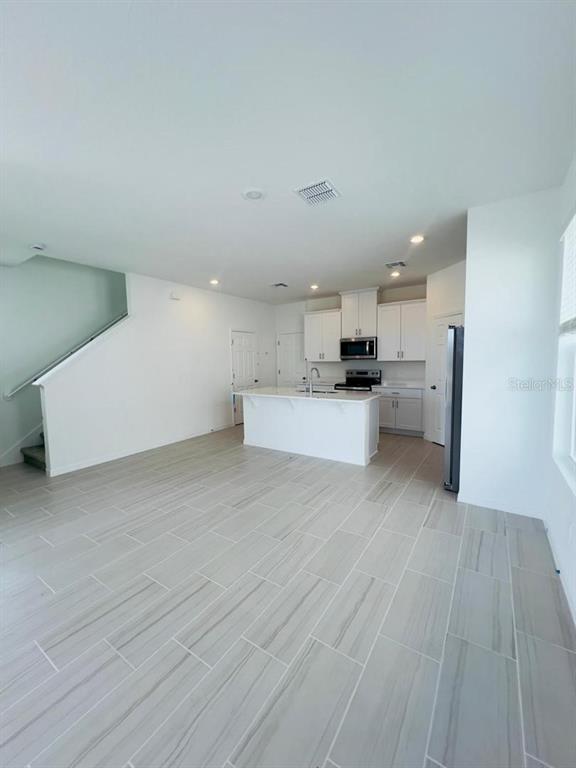 4638 Homestead Trail St. Cloud, FL 34772 - Photo 7 of 30 a view of kitchen and wooden floor