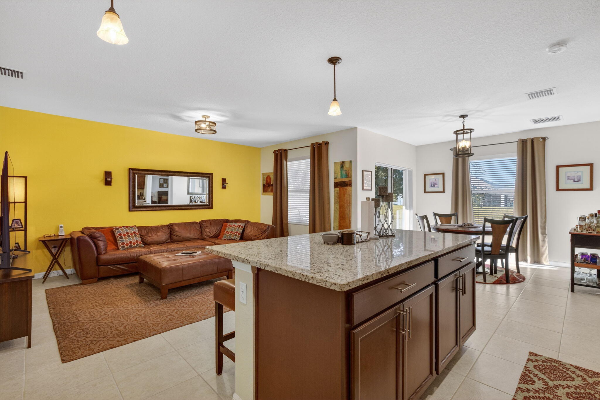 5221 Armina Place Fort Pierce, FL 34951 - Photo 11 of 40 a view of kitchen island with stainless steel appliances granite countertop living room