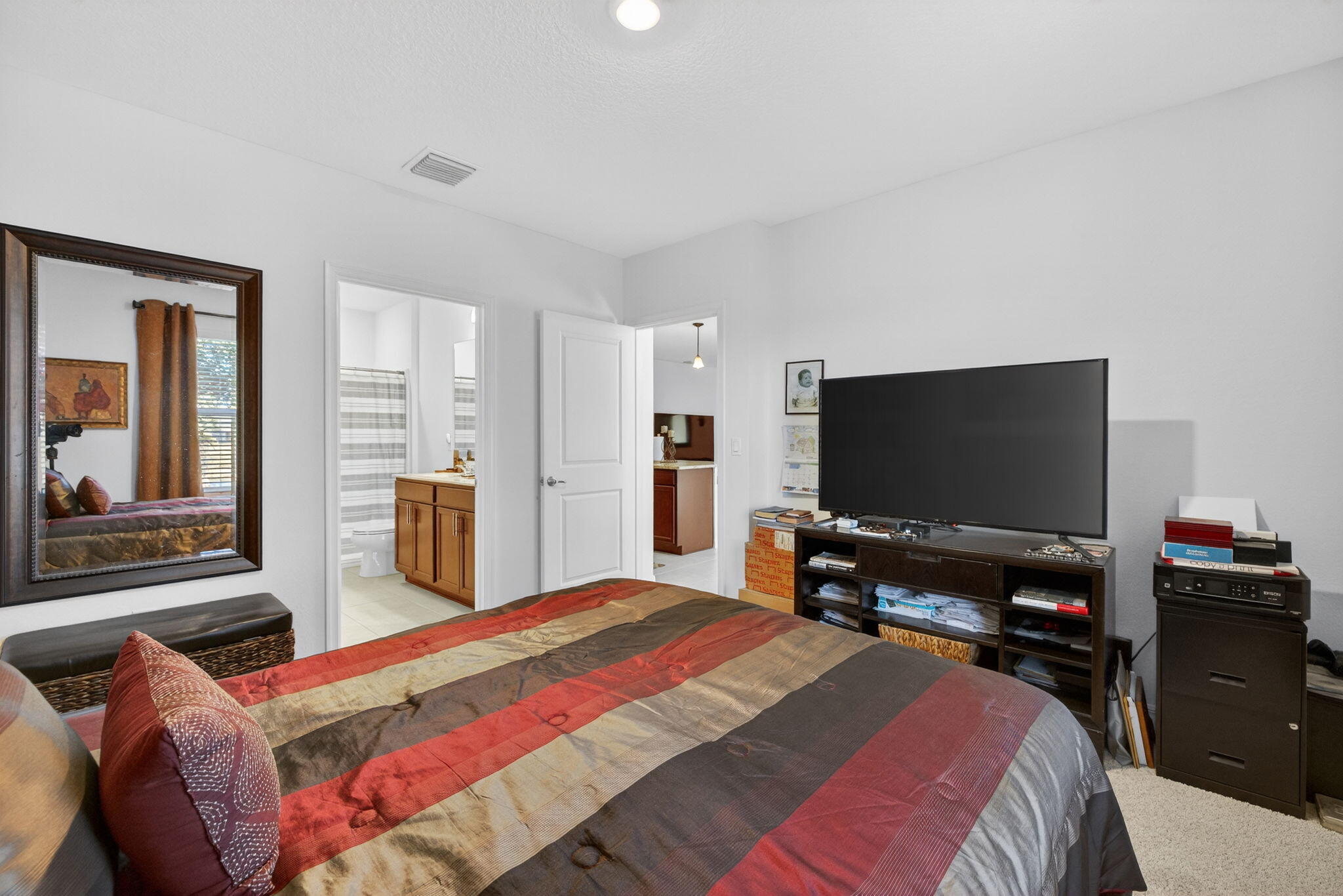 5221 Armina Place Fort Pierce, FL 34951 - Photo 14 of 40 a bedroom with a bed and a flat screen tv